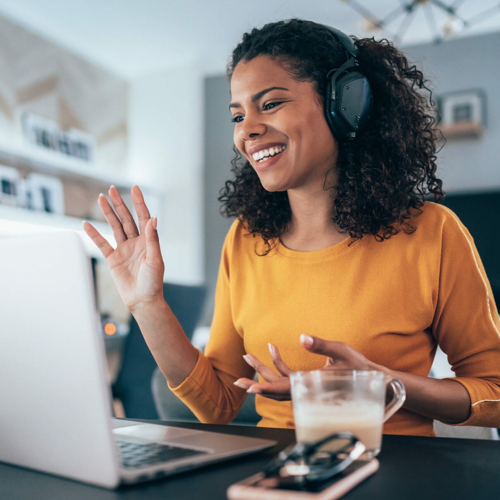 Young modern woman having Video Conference at home